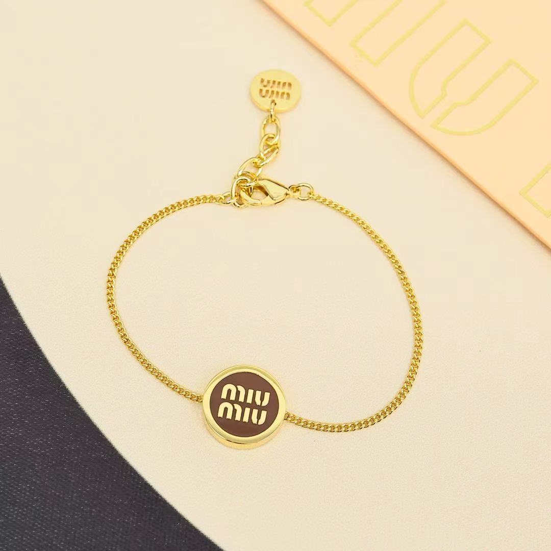 MIUMIU 26S ROUND LOGO CHAIN BRACELET IN GOLD TONE METAL 621549
